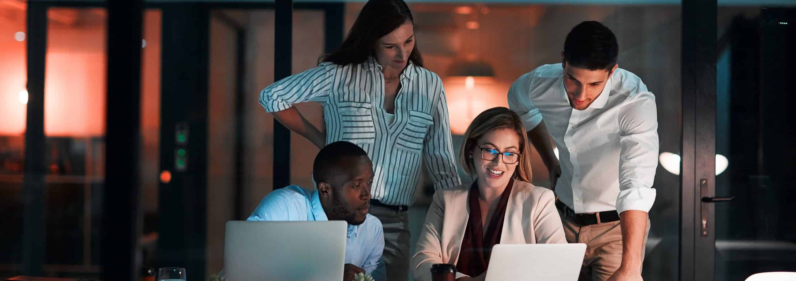 Team,,Laptop,And,Business,People,In,Office,At,Night,With